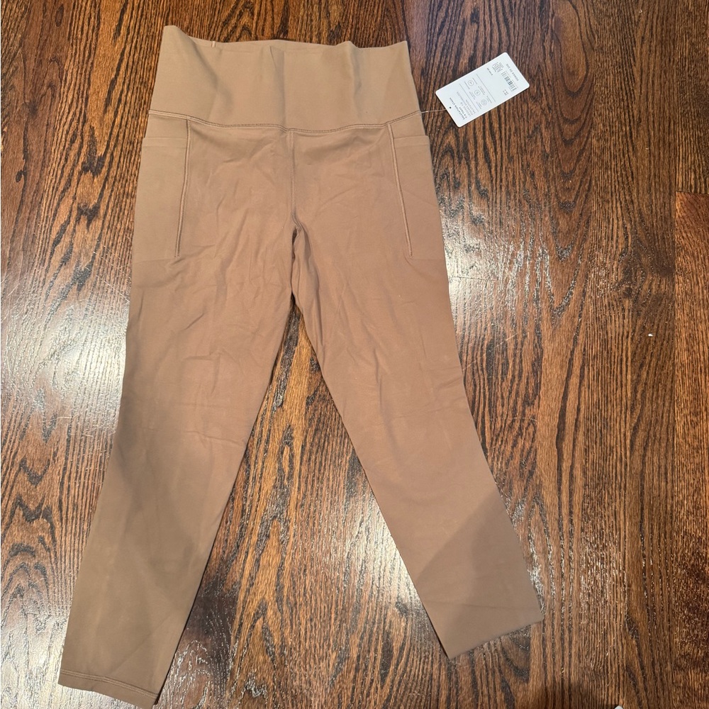 Athleta tan salutation stash 7/8 legging